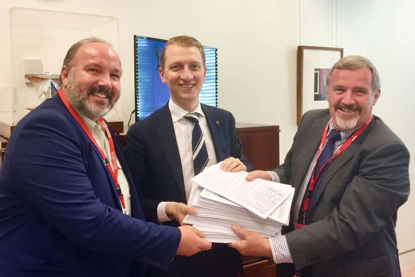 Photo left to right: Ian Worby, Sen. James Paterson and Keith Buxton. Ian and Keith presenting the 8000+ signatures to Sen. Paterson