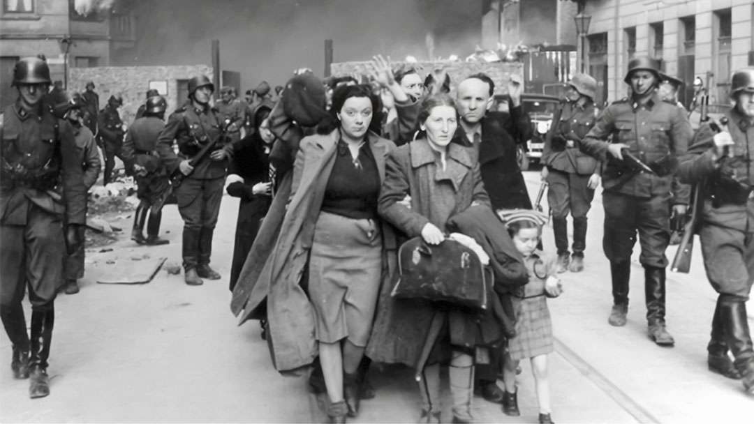 Captured Jews who participated in the Warsaw Ghetto Uprising are rounded up by the Waffen SS on Nowolipie Street between April 19 and May 16, 1943